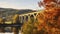 The Railway Bridge of Dolni Loucky Amidst a Foggy Autumn Splendor. Generative AI