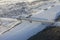 Railway bridge over the Lena river in winter from a plane