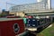 Railway Bridge over Moored canal boats. Regents Canal. Mile End, London. UK