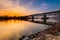 Railway bridge over the river danube in Regensburg on a cold damp winter morning at sunrise with snow