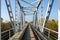 Railway bridge rails, stretching into perspective
