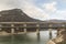 A railway bridge with trains passing over Tsonevo dam.