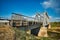 Railway Bridge view. Railroad Path leading into the distance of the blue sky.