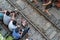 Railway cafe. People drink coffee or walking on railways waiting for train to arrive on railway road in Hanoi, Vietnam