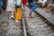 Railway cafe. People drink coffee or walking on railways waiting for train to arrive on railway road in Hanoi, Vietnam