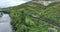 Railway cargo train wagon rides on railroad. Transportation and delivery of cargo in containers. Aerial view over train