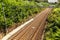 Railway corridor on the Tisnov - Brno route near the town of Kurim in the Czech Republic. Electrified railway line. Train tracks.