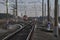 Railway crossroad in the evening, blurred trains at background.