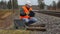 Railway employee with documents near railway