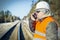 Railway engineer talking on the cell phone on railway