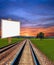 Railway in field with placard