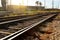 Railway and industrial buildings on a bright sunny day, diminishing perspective