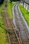 Railway infrastructure on a summer day. Tracks, rails, wires and semaphores.