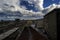 A railway junction at a large railway station under the storm clouds