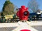 Railway level crossing gate with red vintage warning lamp.