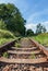 Railway old rusty track detail with landscape