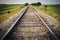 Railway, Railroad, Train Tracks, With Green Pasture Early Morning