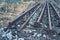 Railway rails scrap. Recycling industry. Metal material is waiting for transport