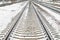 Railway rails sleepers away snow in winter