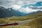 Railway and red train in Gornergrat mountains. Zermatt, Swiss Alps. Adventure in Switzerland.