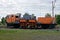 Railway repair train on orange rails