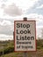 A Railway Safety Sign Saying Stop Look Listen Beware of Train Re