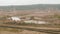 Railway among the sand ballast quarry on the cloudy summer day