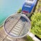 Railway seen from above with incoming train - concept image seen through a magnifying glass