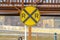 Railway sign with a snowy bridge in the background