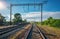 Railway station at bright sunny day in summer. Railroad in Europe