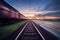 Railway station with cargo wagons in motion blur effect at sunse