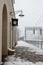 Railway station with outdoor clocks and lamp and rails under snow in winter. Trtavel and journey concept.