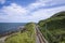 Railway through stone rocks mountain at Irish seacoast