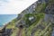 Railway through stone rocks mountain at Irish seacoast