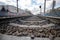 railway with stones close-up on the background of the station