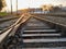 Railway at sunset. Railway station against at sunset. Industrial landscape with a railway. Railway junction. Heavy industry.