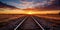 railway at sunset. vast horizon in the desert landscape. Train Path, Iron Tracks, Steel Road, Locomotive Tracks