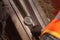 Railway track - concept image seen through a magnifying glass. man examines the rail surface on the railway