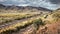 A railway track leading through the dry landscape of southern Peru