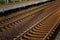 Railway track. Metallic rails and sleepers. Close-up. Travel and tourism. Background. Space for text