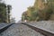 Railway track between trees, single track ,stones