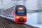 Railway track turn motion blur effect against winter snowy weather. Travel, railway tourism. Blurred railway
