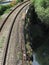 Railway tracks along the river Serchio near Lucca, Tuscany , Italy