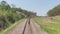 Railway tracks, on both sides of dense green forests