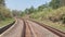 Railway tracks, on both sides of dense green forests