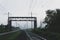 Railway tracks going into the fog, pipelines and chimneys in the haze