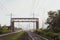 Railway tracks going into the fog, pipelines and chimneys in the haze