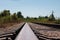 Railway tracks and gravel leading into the infinite distance