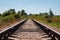 Railway tracks and gravel leading into the infinite distance