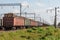 Railway tracks, wagons loaded with logs on rails